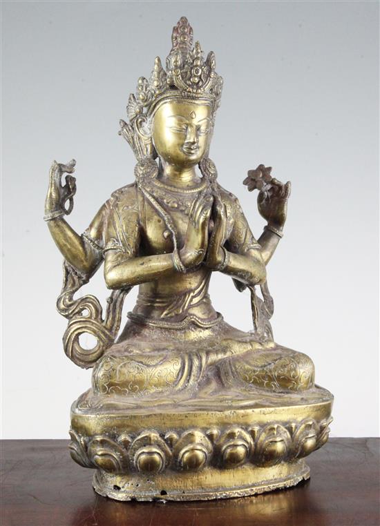 A Tibetan bronze seated figure of Shadakshari Avalokiteshvara, 20th century, 32.5cm